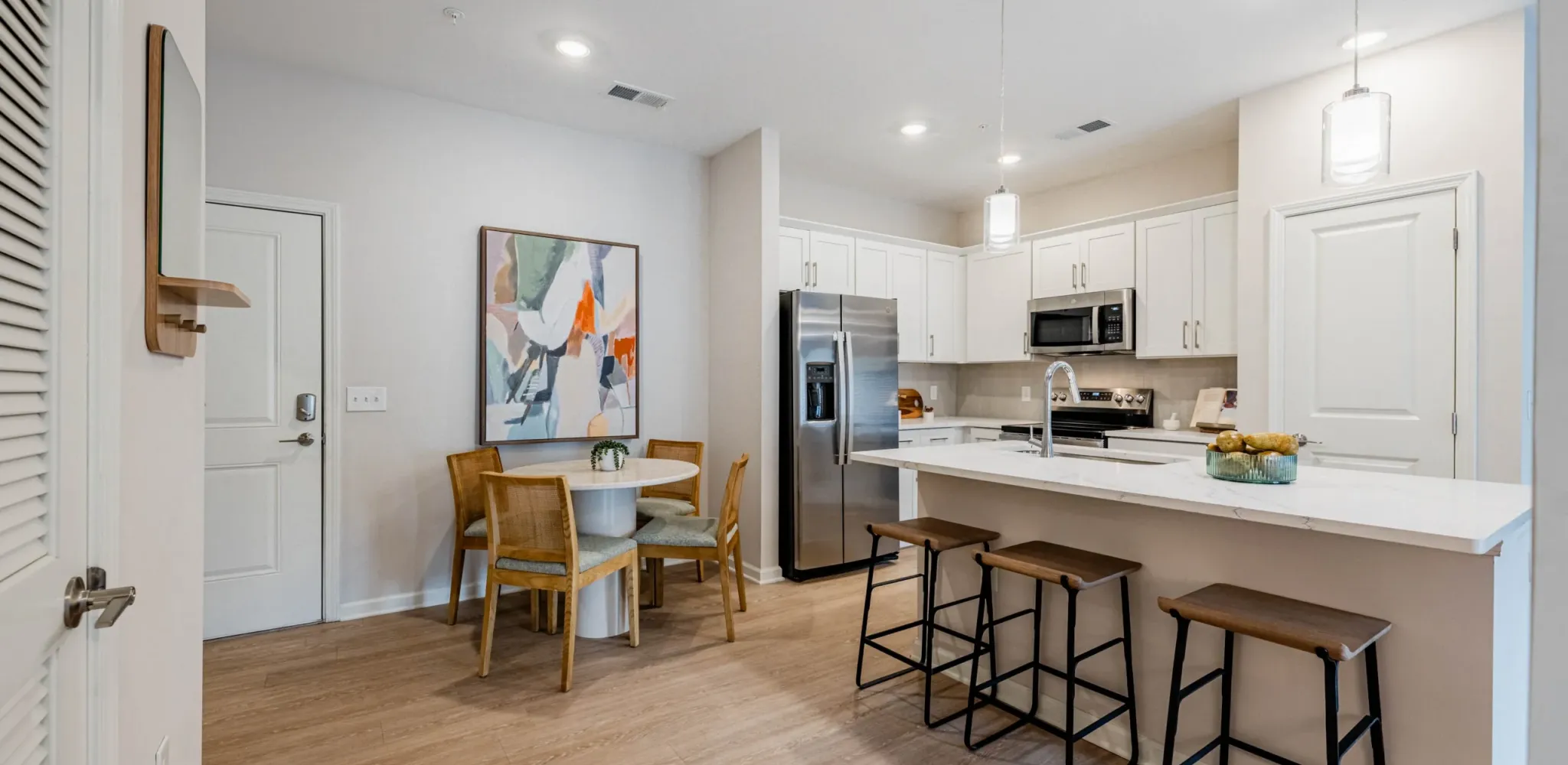 Holly Ridgeapartment living room with large patio doors, furnished with a couch, coffee table, and chair