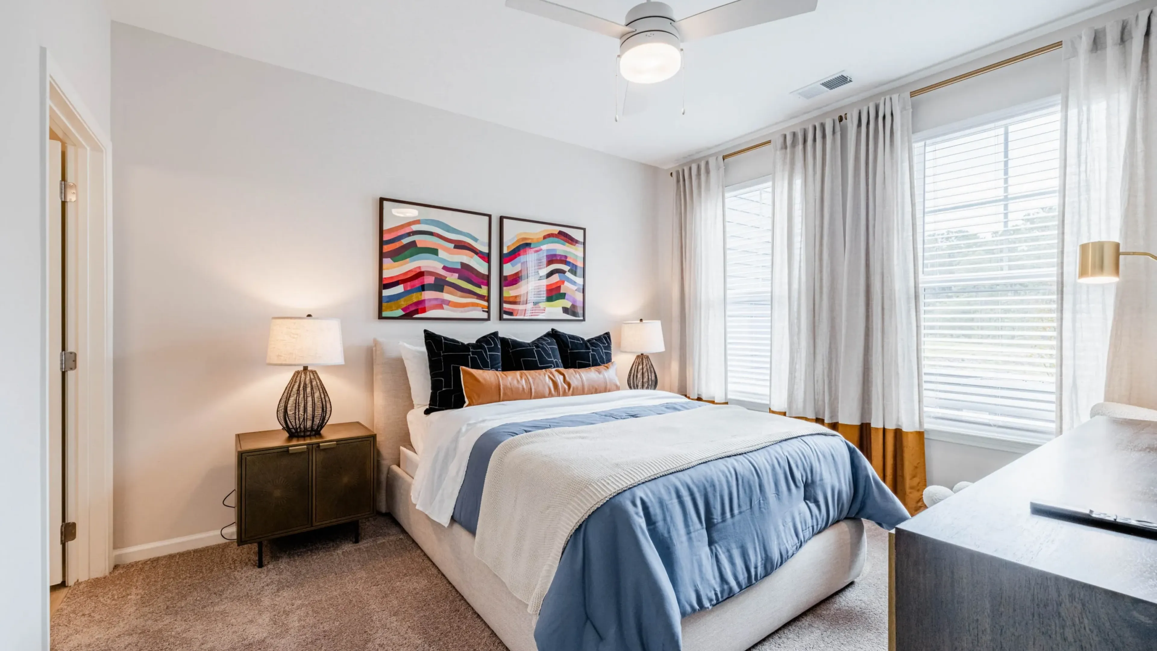 Holly Ridgespacious apartment bedroom furnished with large bed and en suite bathroom